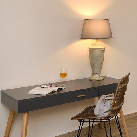 Check your work emails at the desk in the bedroom