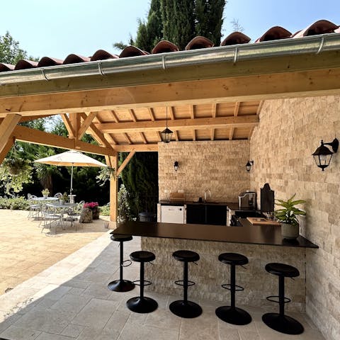 Perch at the summer kitchen's bar and dine alfresco