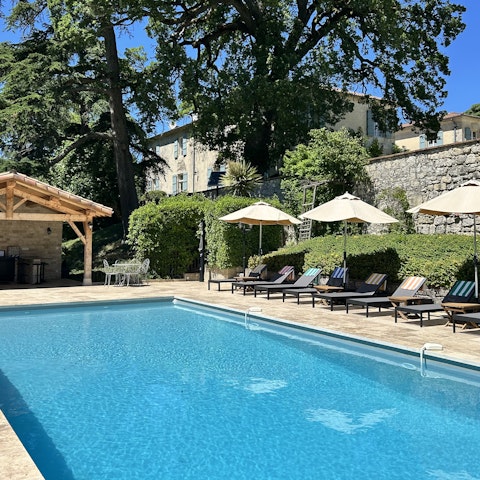 Lie back on the poolside sun loungers as the kids splash in the private pool