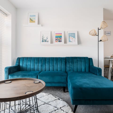 Mix a G&T and get comfy on the blue velvet sofa for a fabulous night in