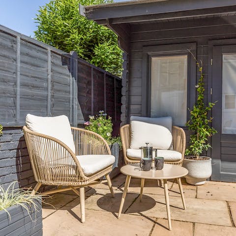 Enjoy a cup of coffee or glass of wine in the sunny garden