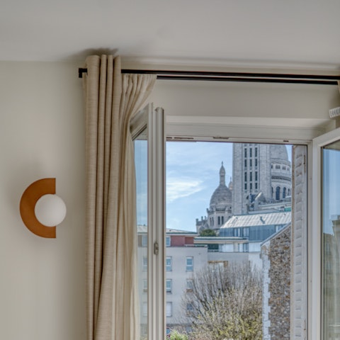 Enjoy views of the Sacré-Cœur from the main bedroom