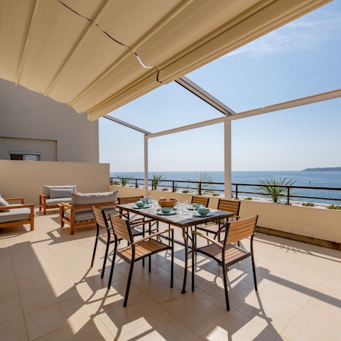 Sip cocktails on the terrace as you admire sweeping sea views