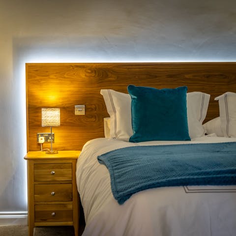 Switch on the backlight behind the comfortable bed