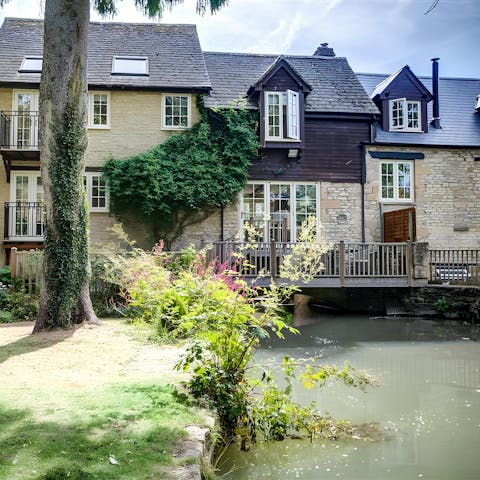 Admire views of the pretty garden and stream from the balcony