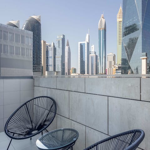 Take in the eclectic architectural styles of the city's skyscrapers from the private balcony