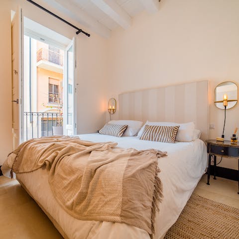 Fling open the balcony doors in the morning and let light flood into the bedroom