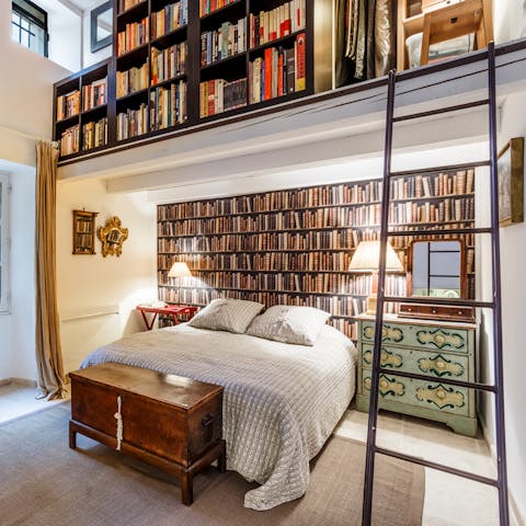 Discover the library of books in the master bedroom