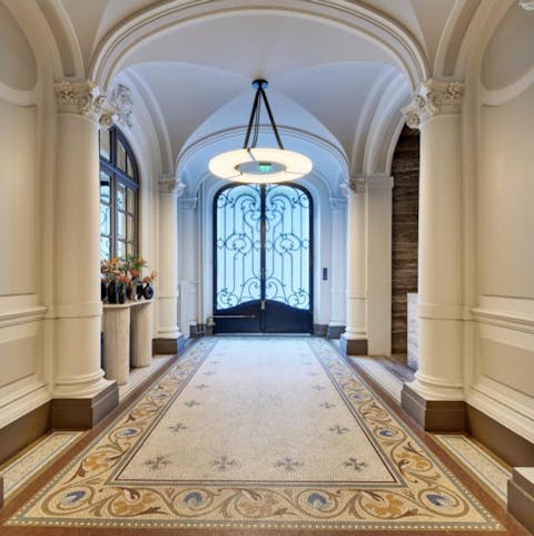 Arrive in style with this Haussmannian building's grand communal lobby