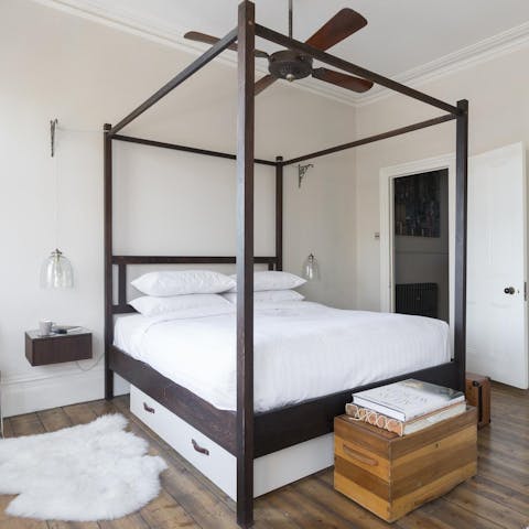 Admire the hand-made four poster bed in the master bedroom