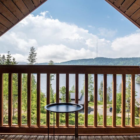 Admire the picturesque views from the cabin's balcony