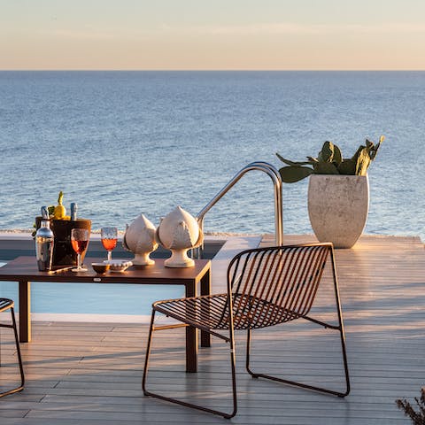 Sip a glass of Frappato from the terrace at the golden hour