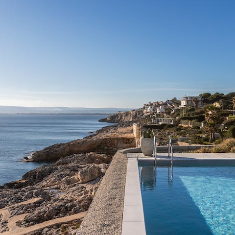 Enjoy a few leisurely laps of the infinity pool overlooking the Ionian