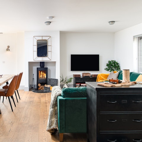 Sprawl out in the modern living room while the fire crackles