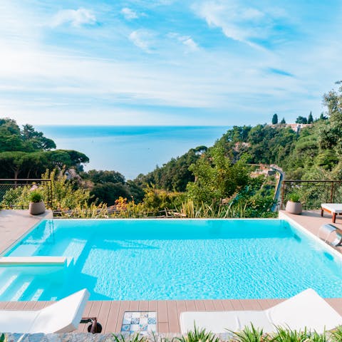 Take in the views of the sparkling sea from the private infinity pool