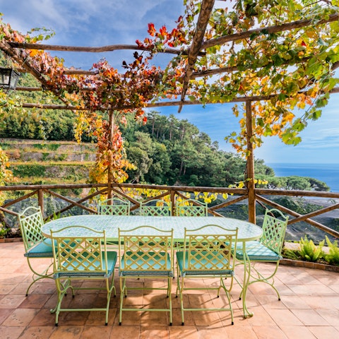 Dine on Italian cuisine under the vine-covered pergola