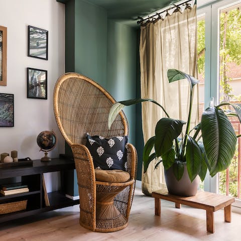 Lounge in the vibrant jungle-inspired living area