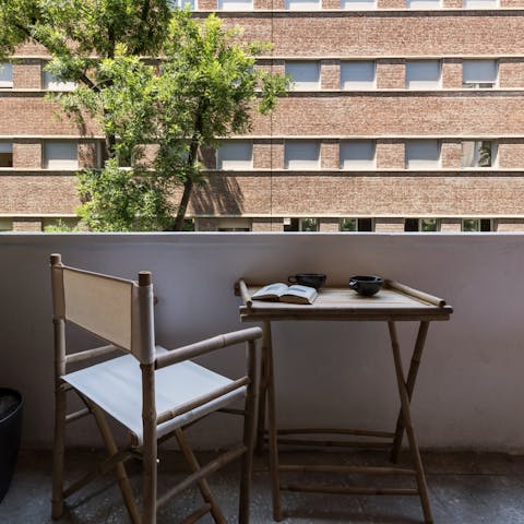 Enjoy a good book with coffee on the balcony