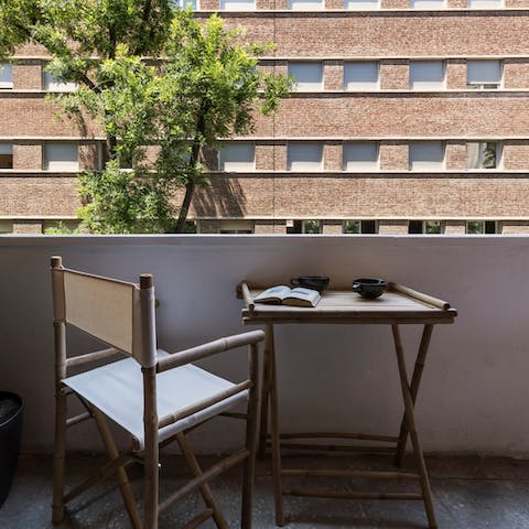 Enjoy a good book with coffee on the balcony