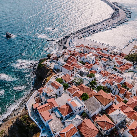 Drive to the red-roofed town of Skopelos