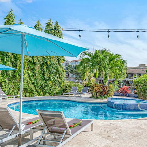 Relax and sunbathe by the shared heated pool