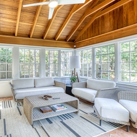 Relax with a cup of tea and a good book in the sunroom