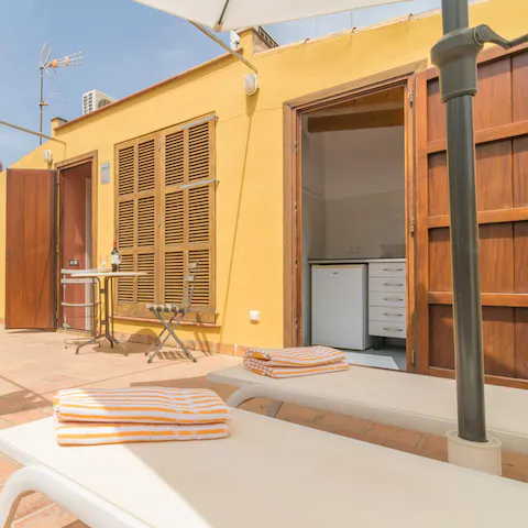 Cook in the well-equipped main kitchen or in the rooftop summer kitchen