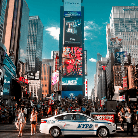 Head over to vibrant Times Square, a ten-minute walk away