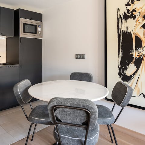 Share your meals at the dining table which also serves as a laptop-friendly workspace