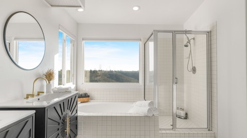 Soak in the bathtub while hillside views stretch out before you