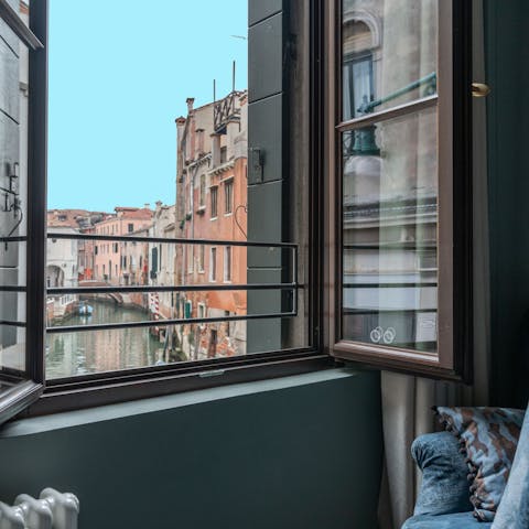 Enjoy canal views from the every window of this apartment
