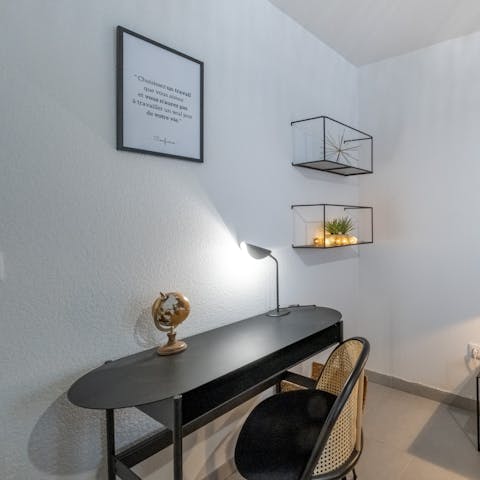 Catch up on work at the bedroom's desk space