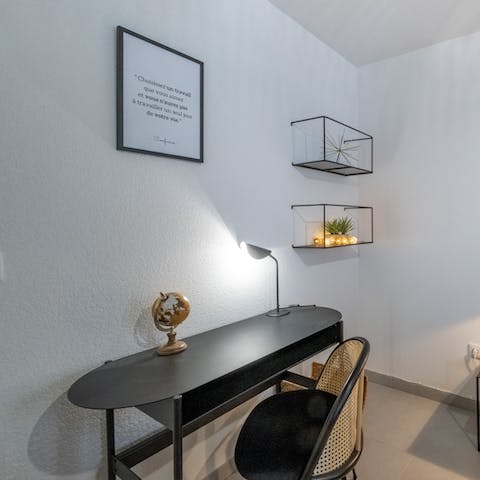 Catch up on work at the bedroom's desk space