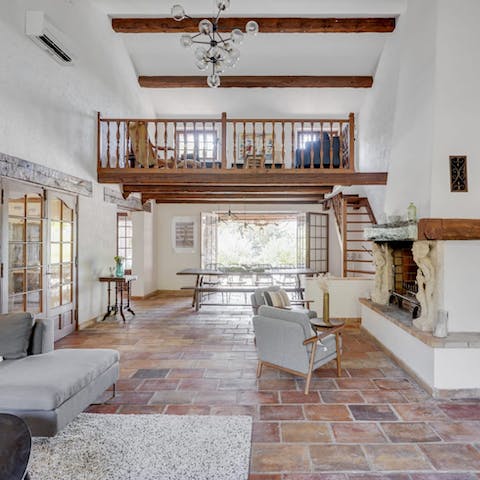 Make yourself at home in the characterful living room, complete with fireplace and mezzanine