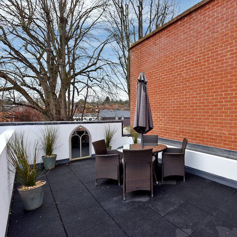 Sip a G&T outside on the private patio after a busy day