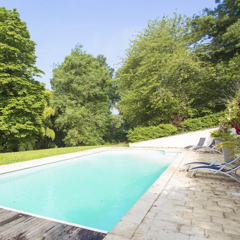 Spend sunny afternoons reclining by the pool with a glass in hand