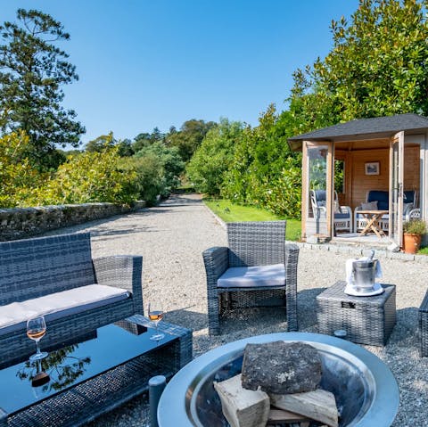 Sit around the fire and enjoy a glass of Cornish wine
