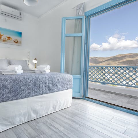 Open the blue-framed sash door and enjoy scenic views from the balcony