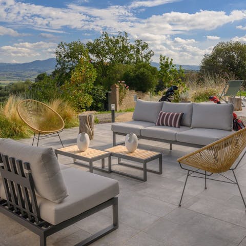 Relax on the sun-kissed terrace with a good book and a glass of wine