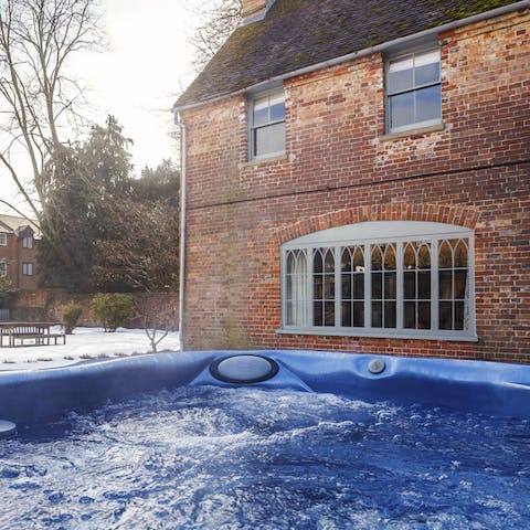 Sip bubbles as the sun goes down in the hot tub