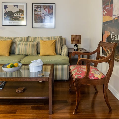 Relax in the classically styled living room with a glass of Spanish wine