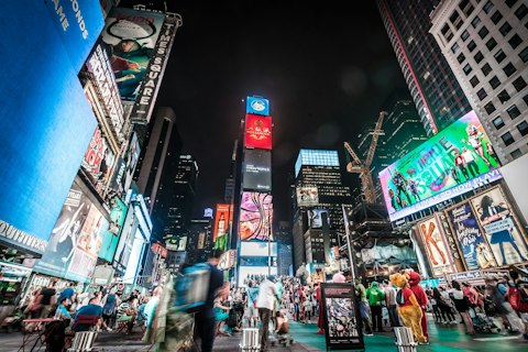 Experience Times Square's dazzling neon energy at the heart of Manhattan, a thirty-two-minute walk