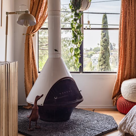 Fire up the funky wood burner in the bedroom on cooler nights