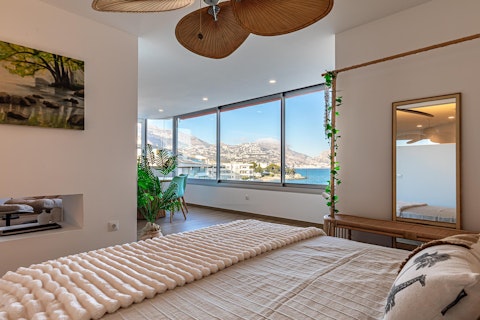Wake to bay views from the comfortable bed