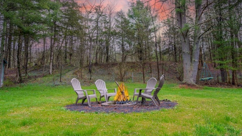 Gather around the fire pit as dusk settles in
