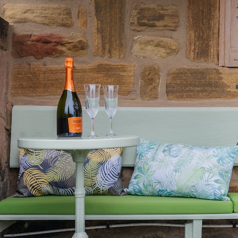 Pop open a bottle of bubbles in the garden alcove