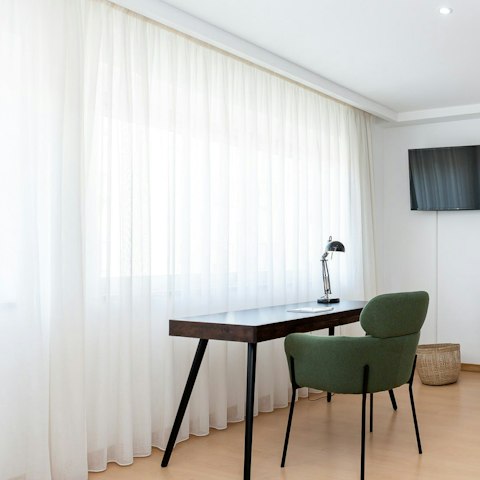 Catch up on work and fire off emails from the sleek desk space