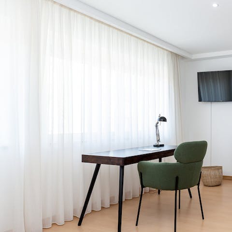 Catch up on work and fire off emails from the sleek desk space