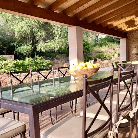 Enjoy a group dinner underneath the shade of the covered terrace