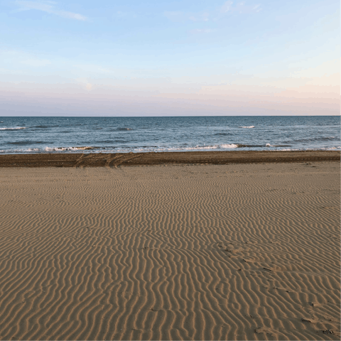 Stroll along the sandy beaches of Lido di Camaiore, 15-minute drive away